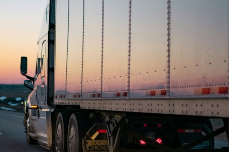 Semi on the highway during sunset