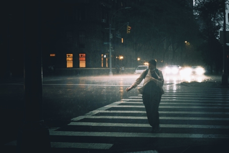 pedestrian walking on the crosswalk in the rain