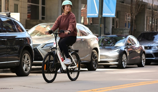 lady on electric bike on the road
