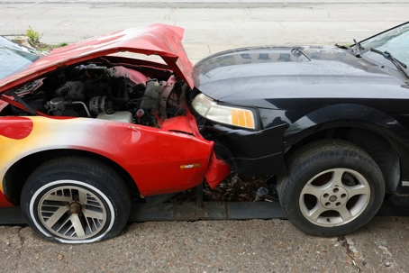 mustang and red car crash