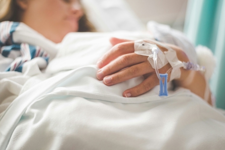 woman in the hospital with hand iv