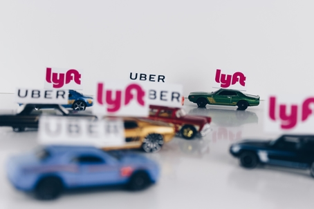 toy cars with Uber and Lyft signs